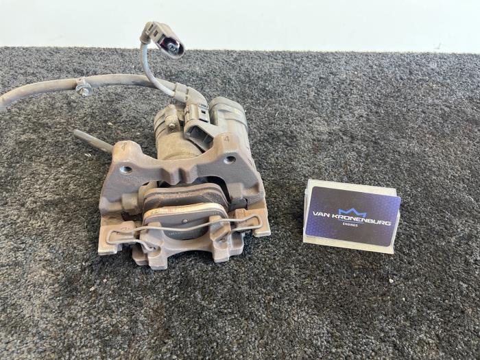 Rear brake calliper, left from a Volkswagen Golf VII (AUA) 2.0 GTD 16V 2014