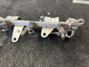 Bränsleinsprutningsmunstycke från en Renault Captur I (2R) 0.9 Energy TCE 12V