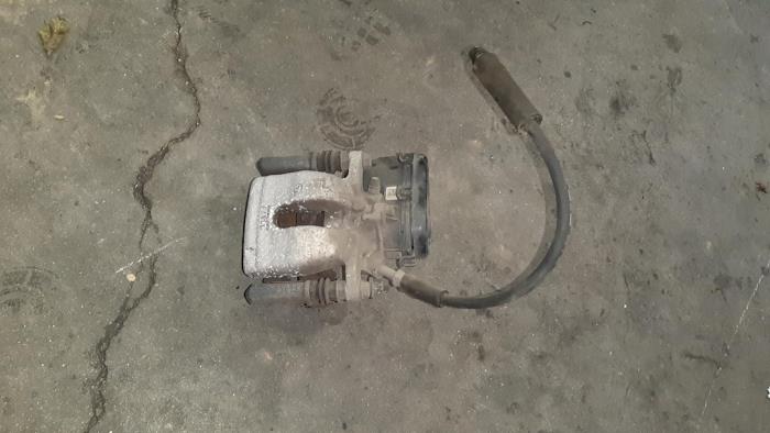 Rear brake calliperholder, left from a Mercedes-Benz A (W176) 1.6 A-180 16V 2015