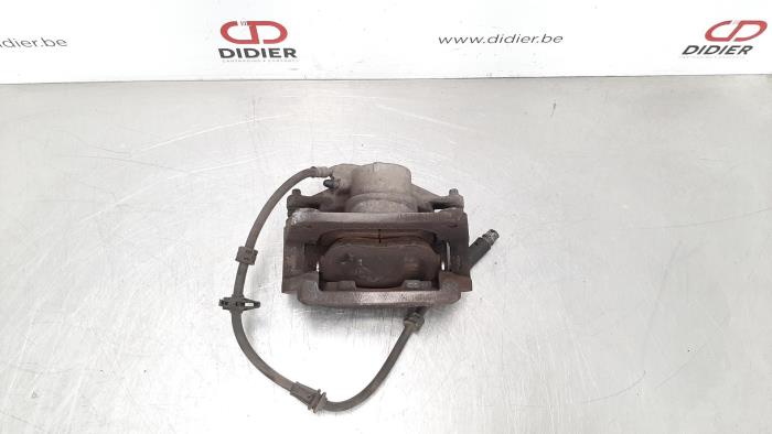 Front brake calliperholder, left from a Peugeot 308 SW (L4/L9/LC/LJ/LR) 1.6 16V GT 205 2017