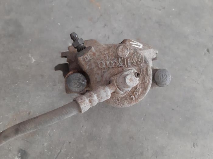 Front brake calliperholder, left from a Skoda Fabia II (5J) 1.2i 12V 2015
