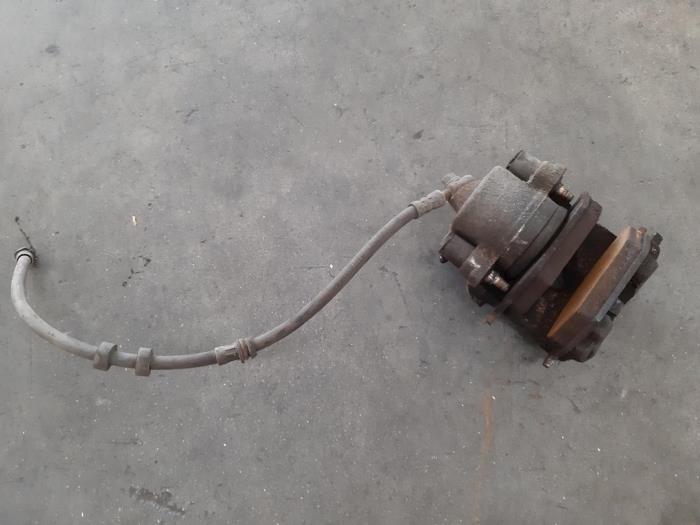 Front brake calliperholder, left from a Skoda Fabia II (5J) 1.2i 12V 2015
