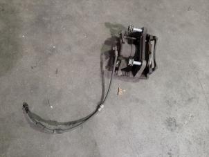 Used Front brake calliperholder, left Volkswagen Tiguan (AD1) 2.0 TDI 16V BlueMotion Technology SCR Price on request offered by Autohandel Didier