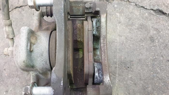 Front brake calliperholder, right from a Ford B-Max (JK8) 1.0 EcoBoost 12V 100 2017