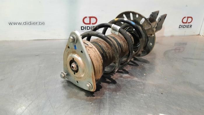 Fronts shock absorber, left from a Opel Combo Cargo 1.2 110 2021