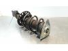 Fronts shock absorber, left from a Opel Combo Cargo 1.2 110 2020
