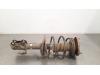 Fronts shock absorber, left from a Toyota Auris Touring Sports (E18) 1.8 16V Hybrid 2014