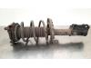 Fronts shock absorber, left from a Kia Ceed Sportswagon (CDF) 1.0i T-GDi 12V 2022