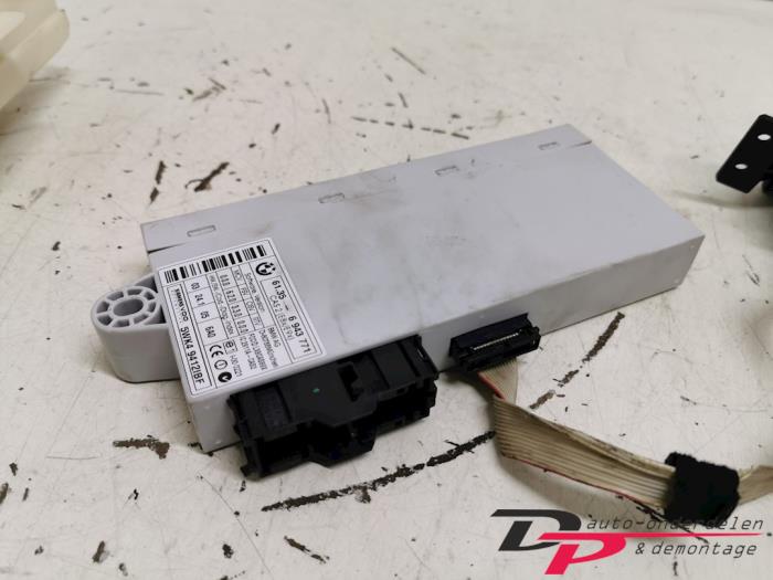 Ignition lock + computer from a BMW 1 serie (E87/87N) 118d 16V 2005