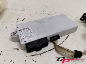 Ignition lock + computer from a BMW 1 serie (E87/87N) 118d 16V 2005