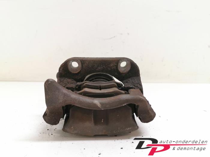 Front brake calliper, left from a Renault Twingo II (CN) 1.2 16V 2008