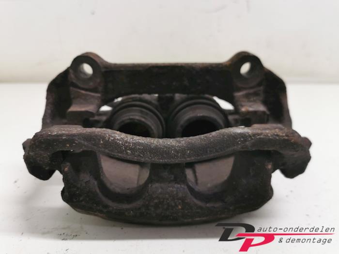 Front brake calliper, left from a Renault Trafic New (FL) 1.9 dCi 100 16V 2003