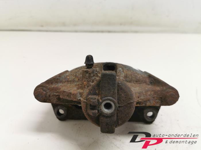Front brake calliper, left from a Suzuki New Ignis (MH) 1.5 16V 4x4 2004