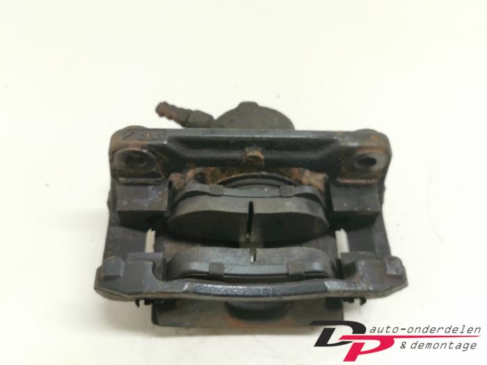 Front brake calliper, left from a Renault Scénic II (JM) 1.5 dCi 80 2005