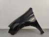 Front wing, left from a Nissan Qashqai (J10) 1.6 16V 2011