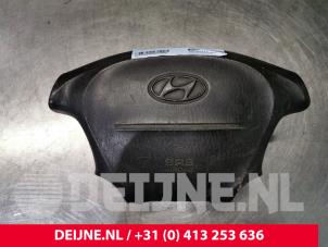 Used Left airbag (steering wheel) Hyundai H-1/H-200 2.5 CRDi Cargo Price on request offered by van Deijne Onderdelen Uden B.V.