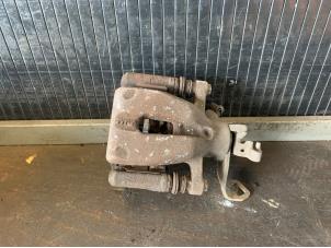 Used Rear brake calliper, left Mini Mini (R56) 1.6 16V Cooper S Price € 39,99 Margin scheme offered by Autodemontage Gout