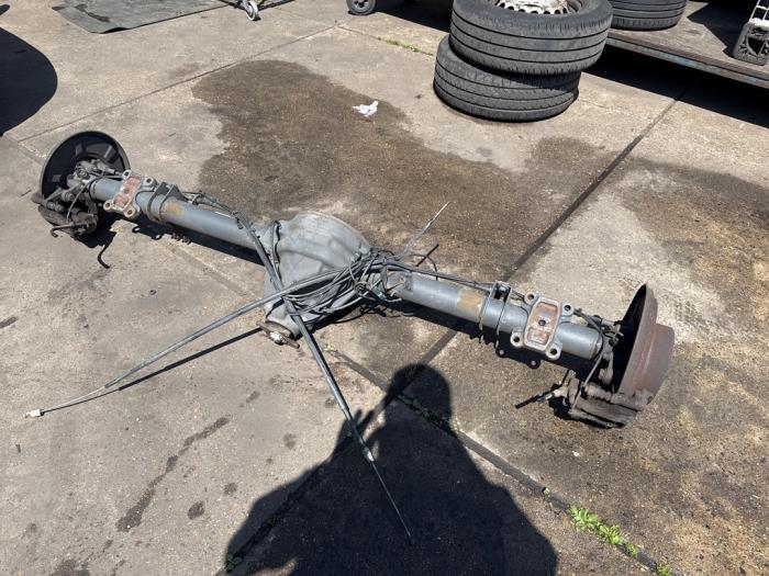 Rear axle beam with reducer