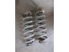 Rear coil spring from a Jaguar XF (X260) 2.0d 180 16V 2015