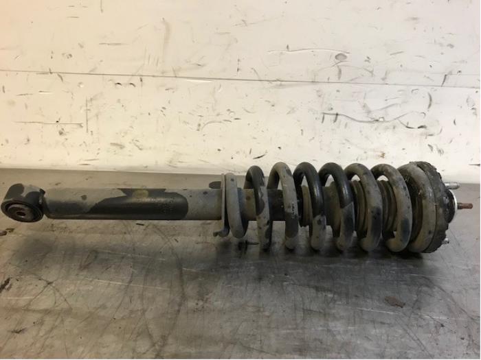 Fronts shock absorber, left from a SsangYong Rodius 2.2 SV 220 e-XDi 16V 2WD 2018