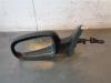 Wing mirror, left from a Opel Corsa 2004