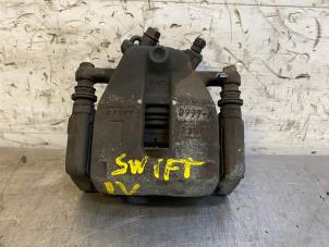 Used Front brake calliper, left Suzuki Swift (ZA/ZC/ZD1/2/3/9) 1.3 VVT 16V Price on request offered by Autohandel-Smet Gebroeders NV