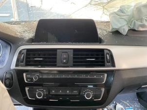 Gebrauchte Radiobedienfeld BMW 1 serie (F20) 116i 1.5 12V Preis auf Anfrage angeboten von Autohandel-Smet Gebroeders NV