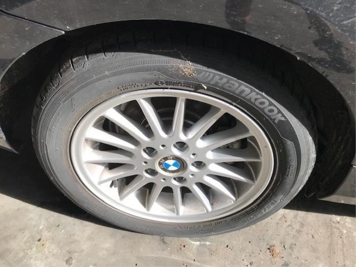 Set of wheels + tyres from a BMW 1 serie (E81) 116i 1.6 16V 2009