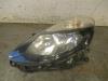 Headlight, left from a Renault Clio III (BR/CR) 1.5 dCi FAP 2011