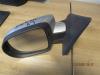 Wing mirror, left from a Renault Clio III (BR/CR) 1.5 dCi FAP 2011