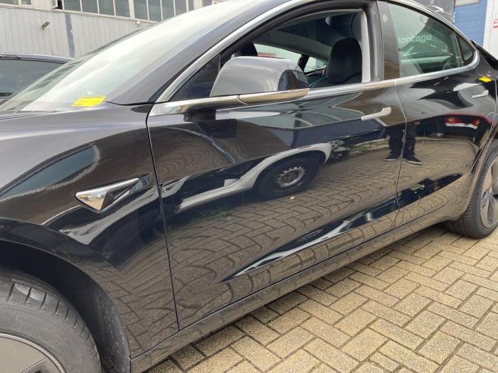 Door 4-door, front left from a Tesla Model 3 EV AWD 2019