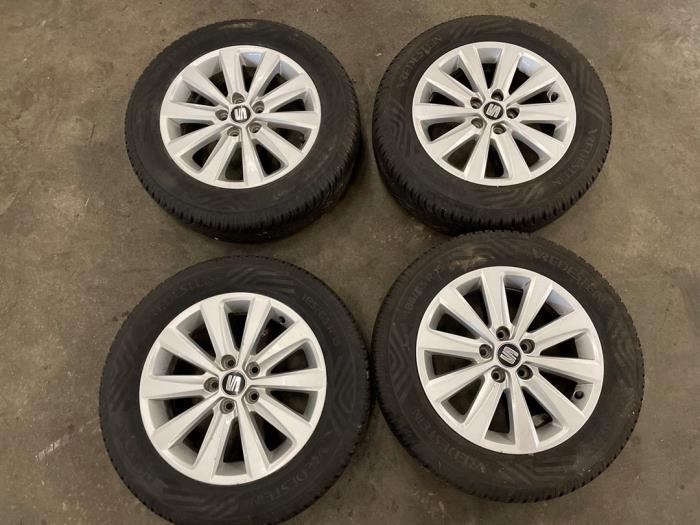 Set of wheels + winter tyres from a Seat Ibiza V (KJB) 1.0 TSI 12V 2017
