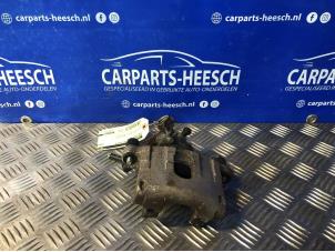 Used Rear brake calliper, left Ford Focus Price € 26,25 Margin scheme offered by Carparts Heesch