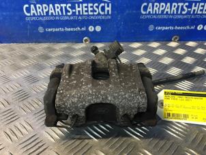 Used Rear brake calliper, right Ford Focus 3 Wagon 1.0 Ti-VCT EcoBoost 12V 100 Price € 26,25 Margin scheme offered by Carparts Heesch