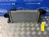 Intercooler from a Ford Focus 3 Wagon, 2010 / 2020 1.0 Ti-VCT EcoBoost 12V 125, Combi/o, Petrol, 998cc, 92kW (125pk), FWD, M1DA, 2012-02 / 2018-05 2014