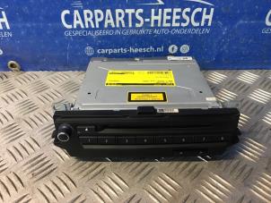 Used CD changer BMW 1 serie (E81) 116i 1.6 16V Price € 183,75 Margin scheme offered by Carparts Heesch