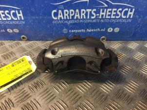 Used Front brake calliper, left Ford Fiesta 7 1.1 Ti-VCT 12V 85 Price € 31,50 Margin scheme offered by Carparts Heesch