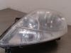 Headlight, left from a Renault Trafic New (FL) 1.9 dCi 100 16V 2004