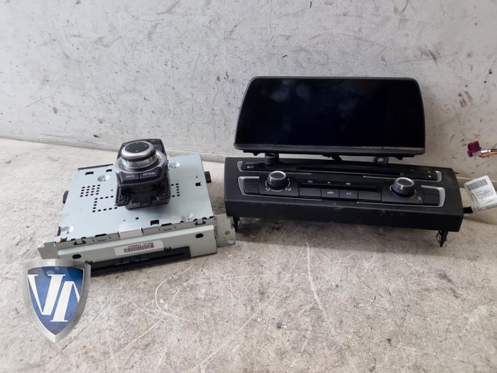 Gebrauchte Navigation Set BMW 1 serie (F21) 114i 1.6 16V Preis € 423,50 Mit Mehrwertsteuer angeboten von Vollux Carparts B.V.