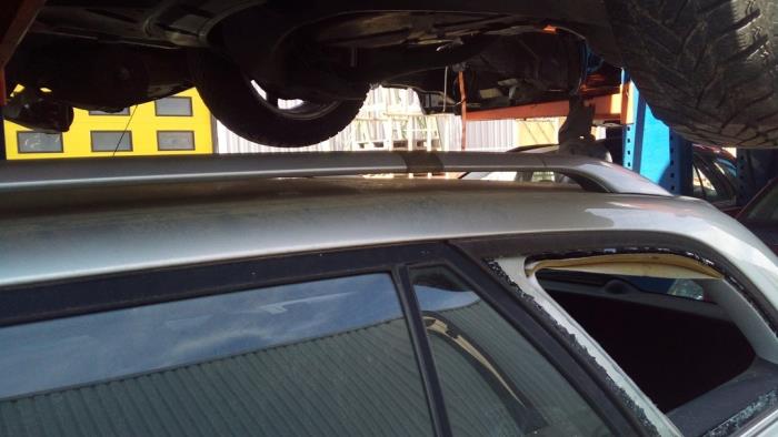 Roof rail, left from a Toyota Avensis Wagon (T25/B1E)  2006