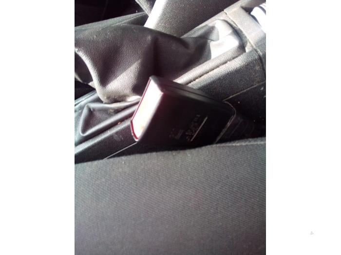 Front seatbelt buckle, left from a Opel Corsa D 1.2 16V 2006