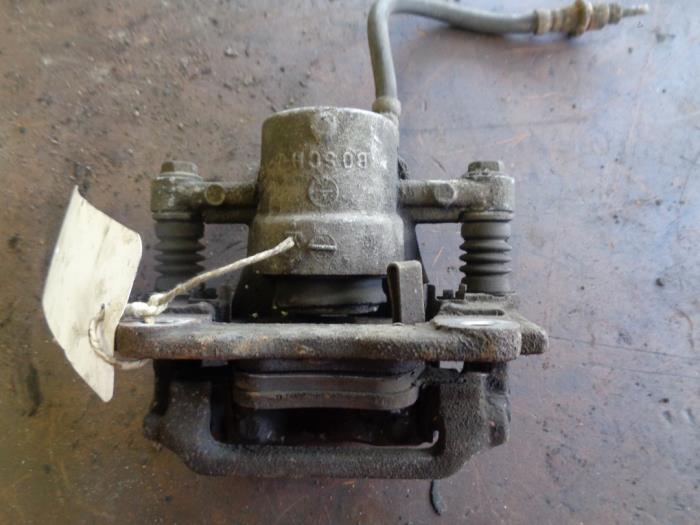Rear brake calliper, left from a Toyota Corolla Verso (R10/11) 2.0 D-4D 16V 2006