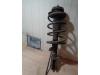 Fronts shock absorber, left from a Renault Twingo (C06) 1.2 2005