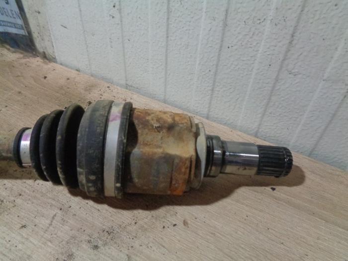 Front drive shaft, left from a Mitsubishi Space Star (A0) 1.2 12V 2021