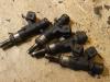 Injector (petrol injection) from a Opel Astra H Twin Top (L67) 1.6 16V Turbo 2008