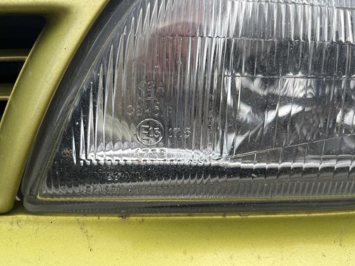 Headlight, left from a Nissan Almera (N15) 1.6 GX,SLX,SR 16V 1997