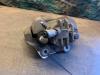 Etrier de frein avant gauche d'un Peugeot 3008 I (0U/HU) 1.6 16V THP 155 2011