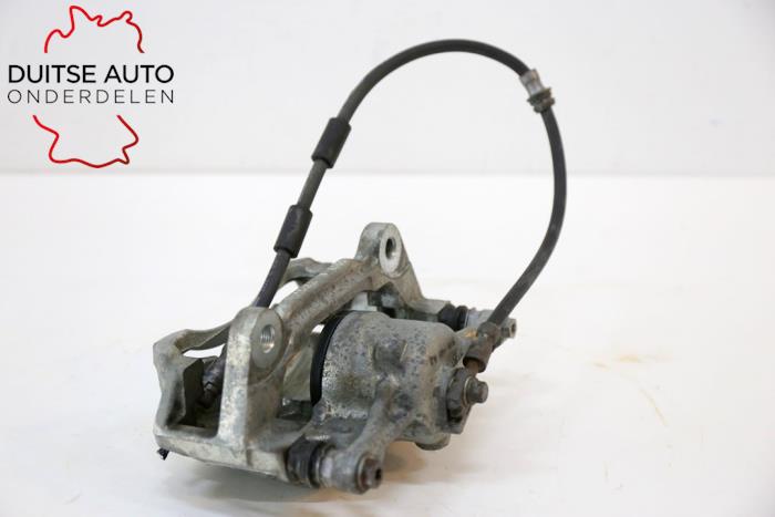 Front brake calliper, left from a Volkswagen Golf VII (AUA) 1.4 TSI 16V 2017
