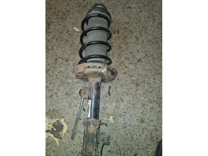 Front shock absorber rod, right from a Opel Corsa D 1.0 2009