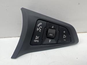 Used Steering wheel mounted radio control Opel Corsa E 1.0 SIDI Turbo 12V Price € 20,00 Margin scheme offered by Autohandel & Demontage Weteringbrug